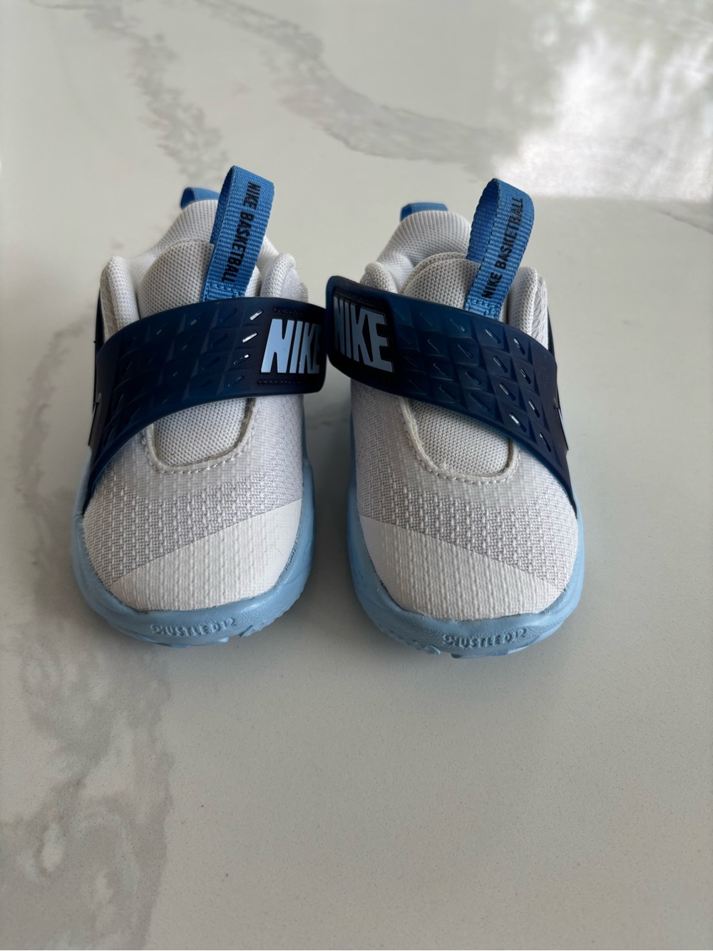 Nike Kids Slip-On Sneakers in White and Navy with Light Blue Sole